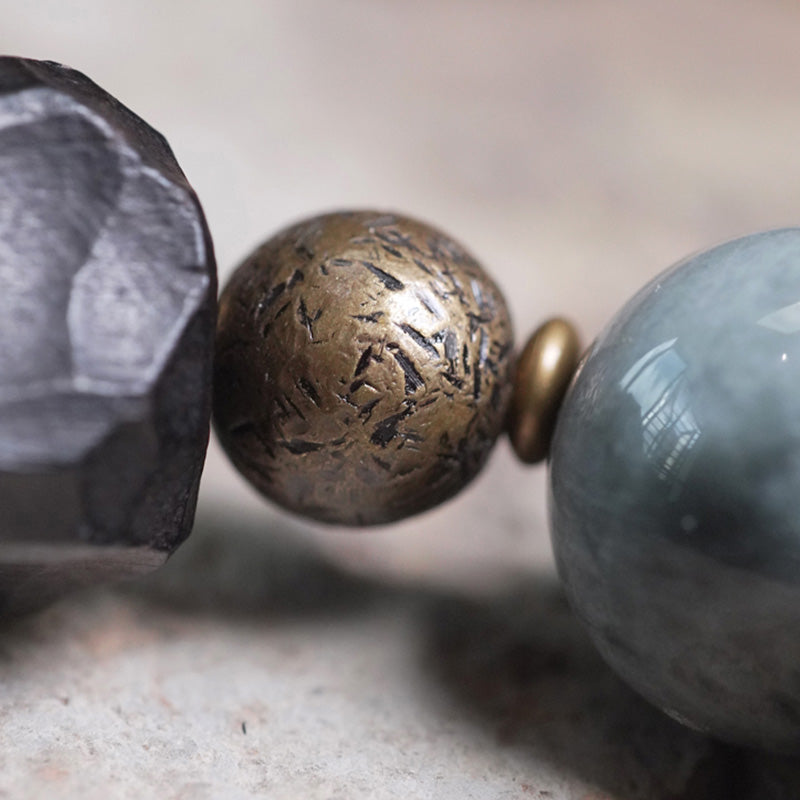 Bracelet couple en pierre œil d'aigle avec bois d'ébène et cuivre