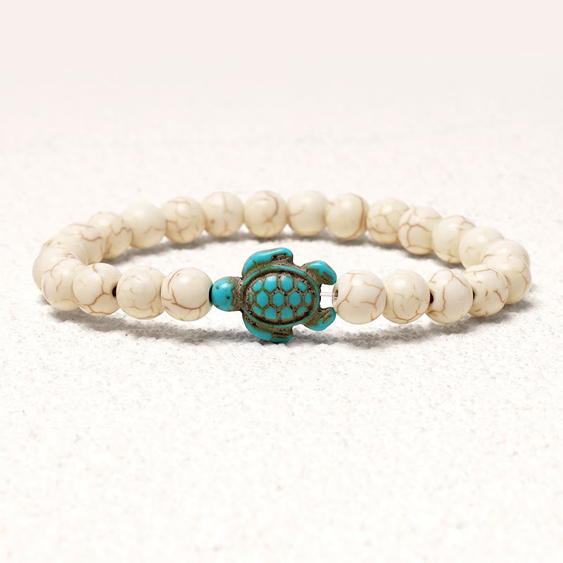 Bracelet turquoise de 8 mm avec breloque tortue de mer