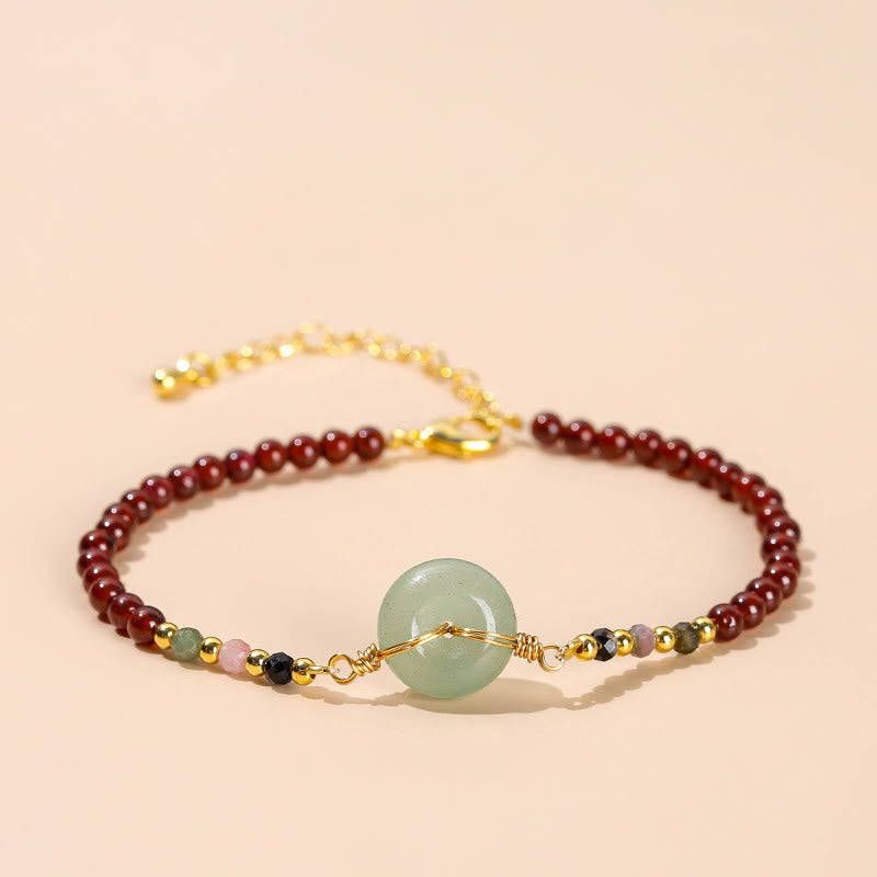 Bracelet calme en perles de grenat naturel avec boucle de paix