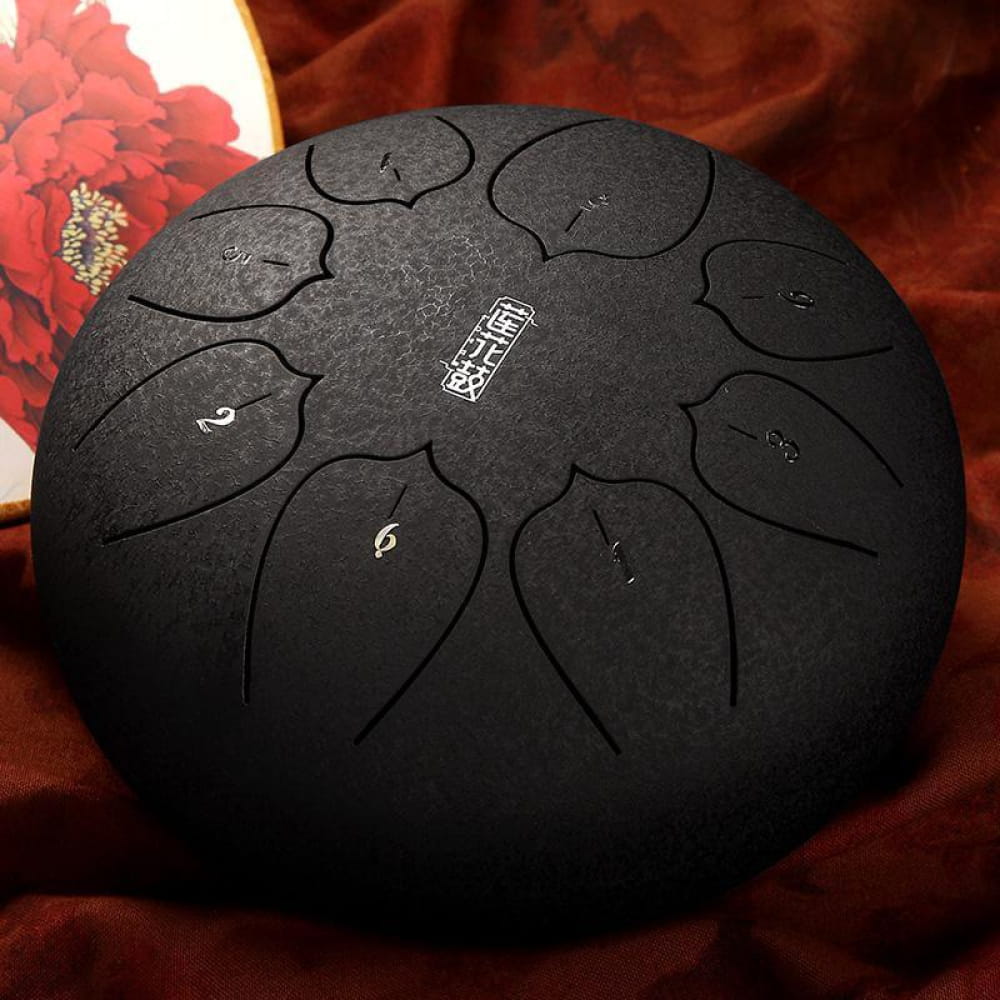 Black Steel Tongue Drum with numbered tone zones in circular pattern for music therapy