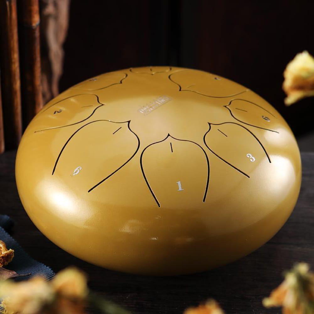 Golden steel tongue drum with petal-shaped tone markings in C key compact design