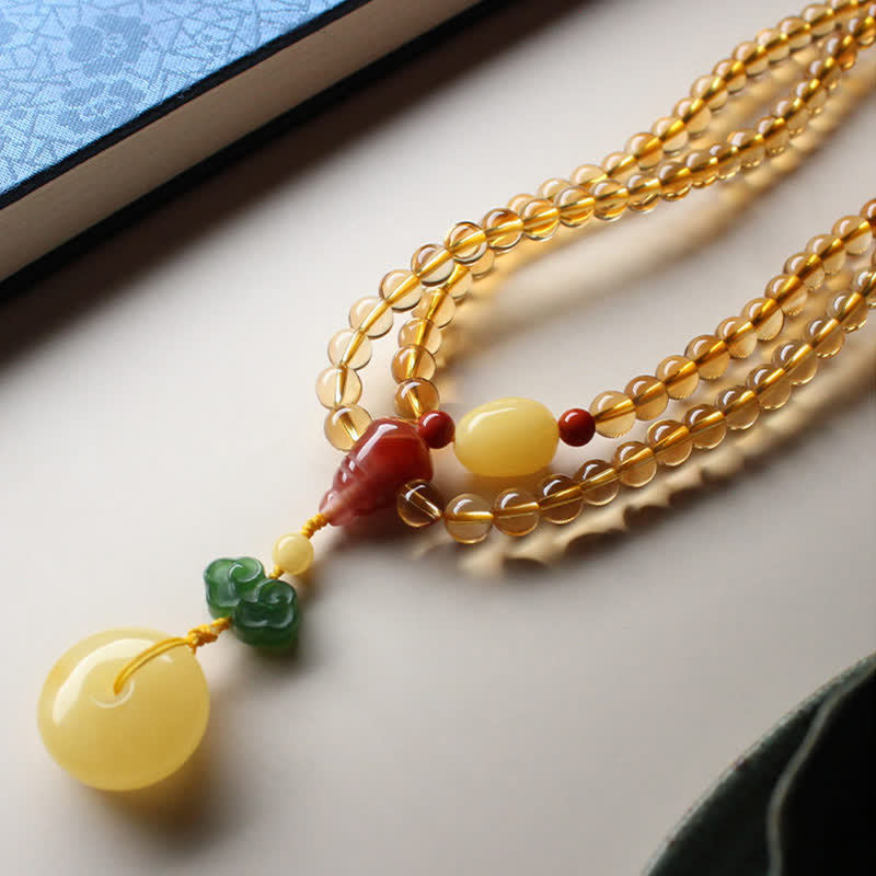 Bracelet Mala 108 perles en citrine et ambre pour la paix