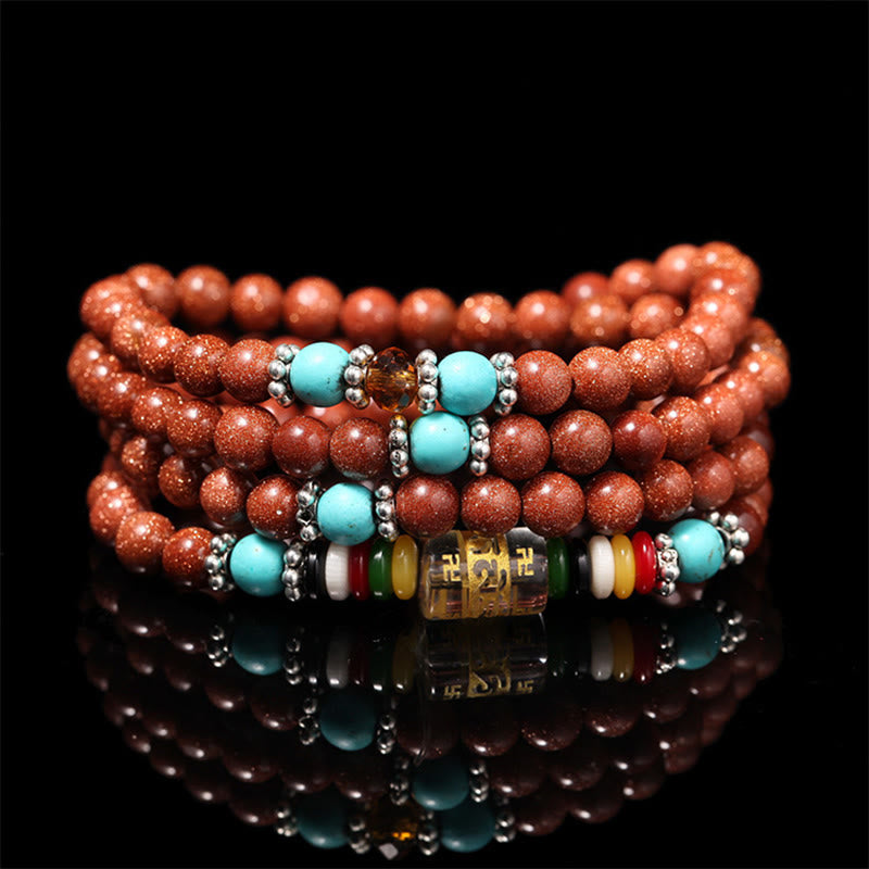 Bracelet Mala en pierres précieuses Goldstone à 108 perles pour plus de confiance