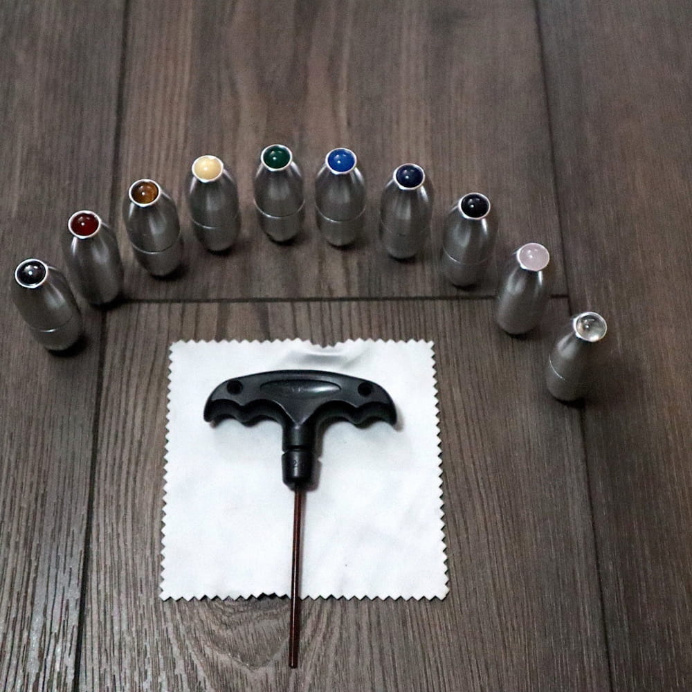 T-handle screwdriver with colorful socket attachments in a semicircle arrangement