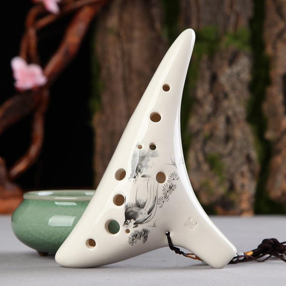 White ceramic 12 Hole Alto C Painted Ocarina with bird artwork and finger holes