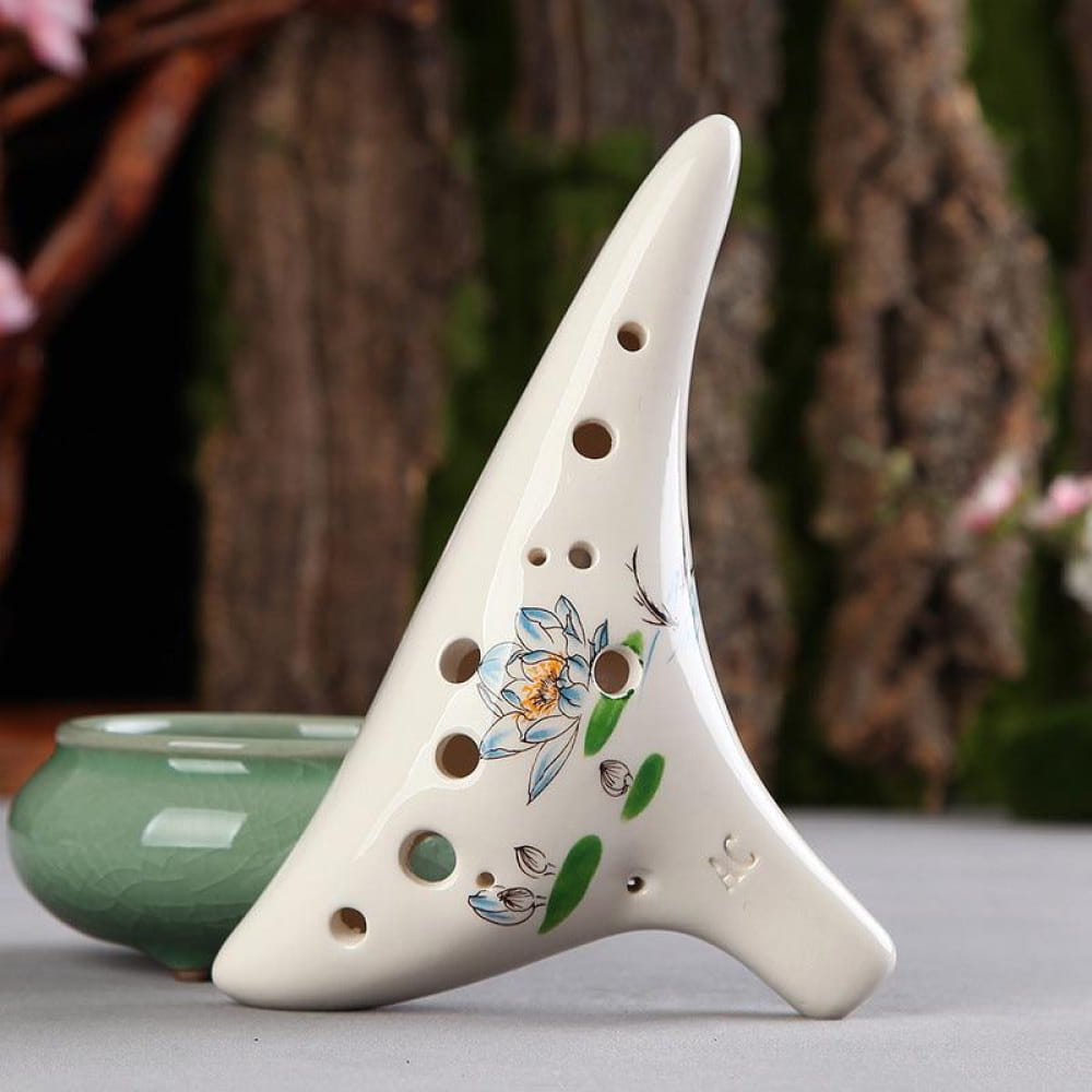 White ceramic 12 Hole Alto C Painted Ocarina with floral design and finger holes