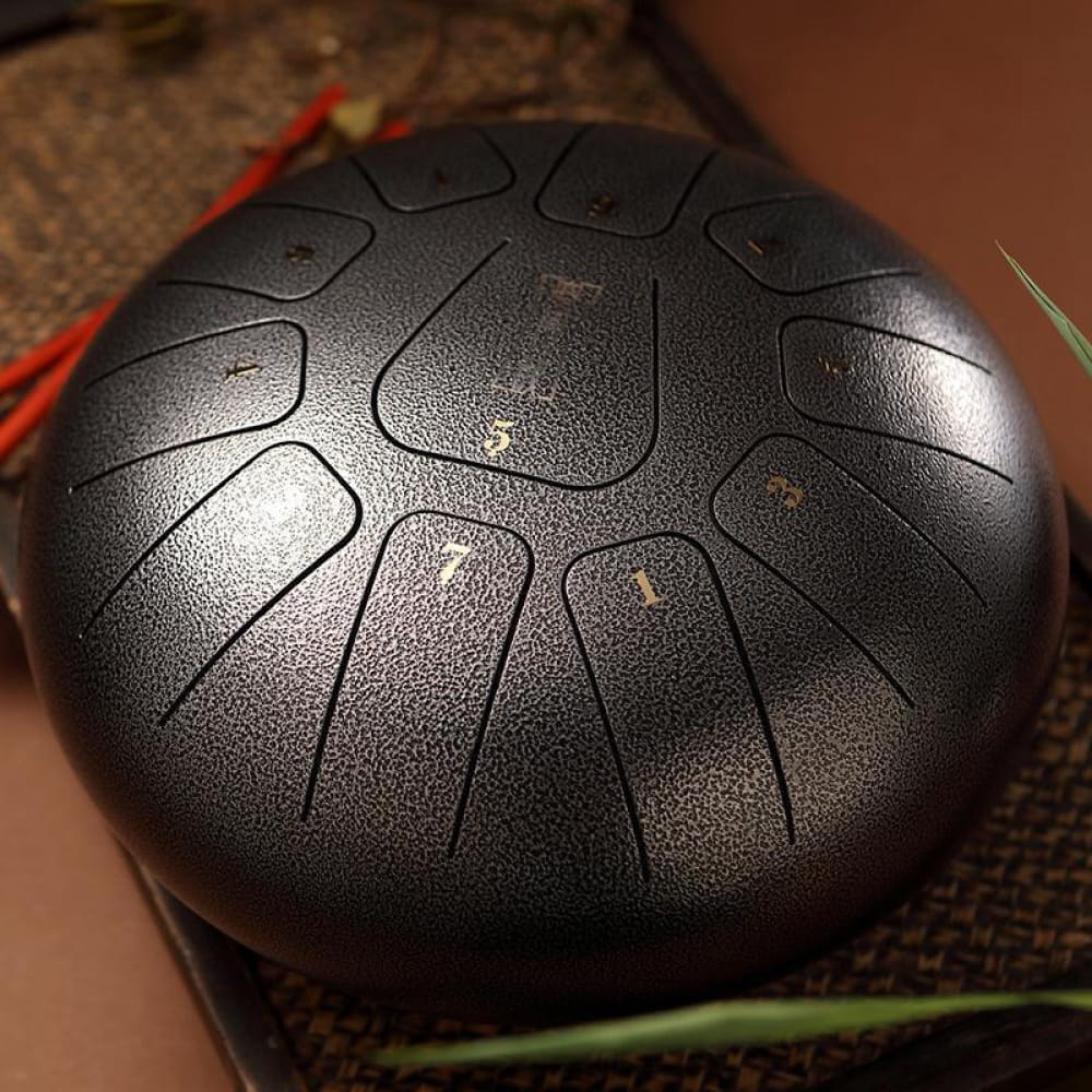 Steel tongue drum with etched notes in circular pattern, 11 tones in C Key