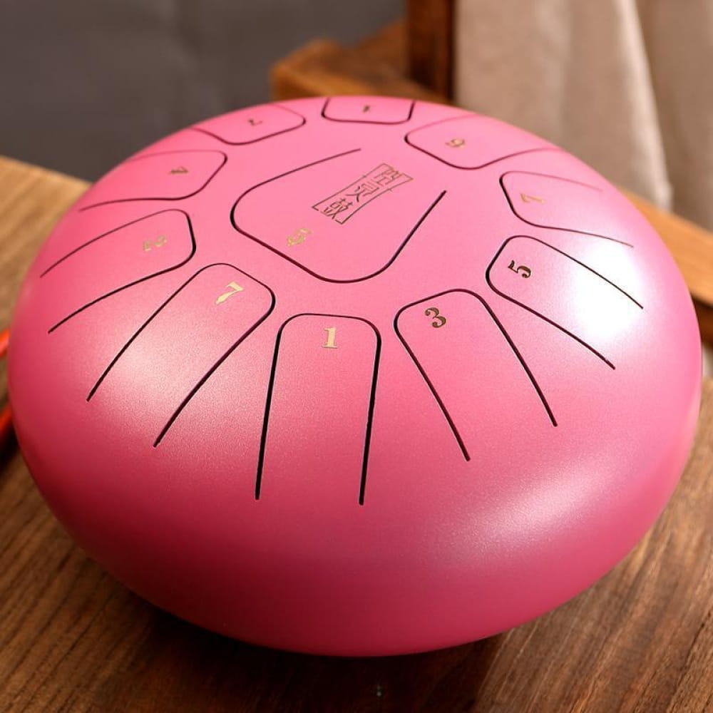 Pink steel tongue drum with numbered tone sections, 12-Inch Carbon Steel, 11 Notes in C Key