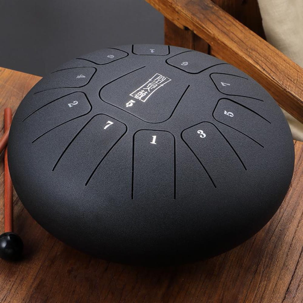 Black steel tongue drum with numbered segments in circular pattern, 12-Inch C Key
