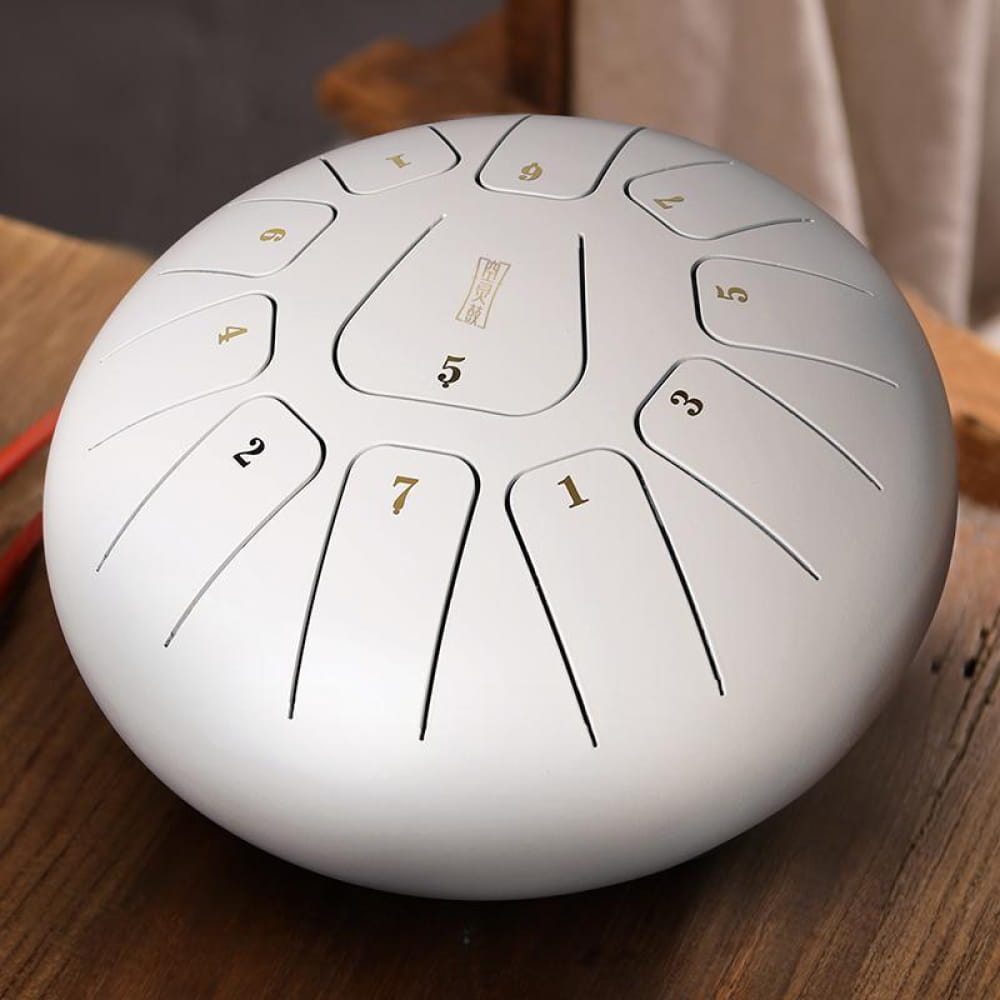 White steel tongue drum with numbered sections for 12-Inch Carbon Steel 11 Notes in C Key