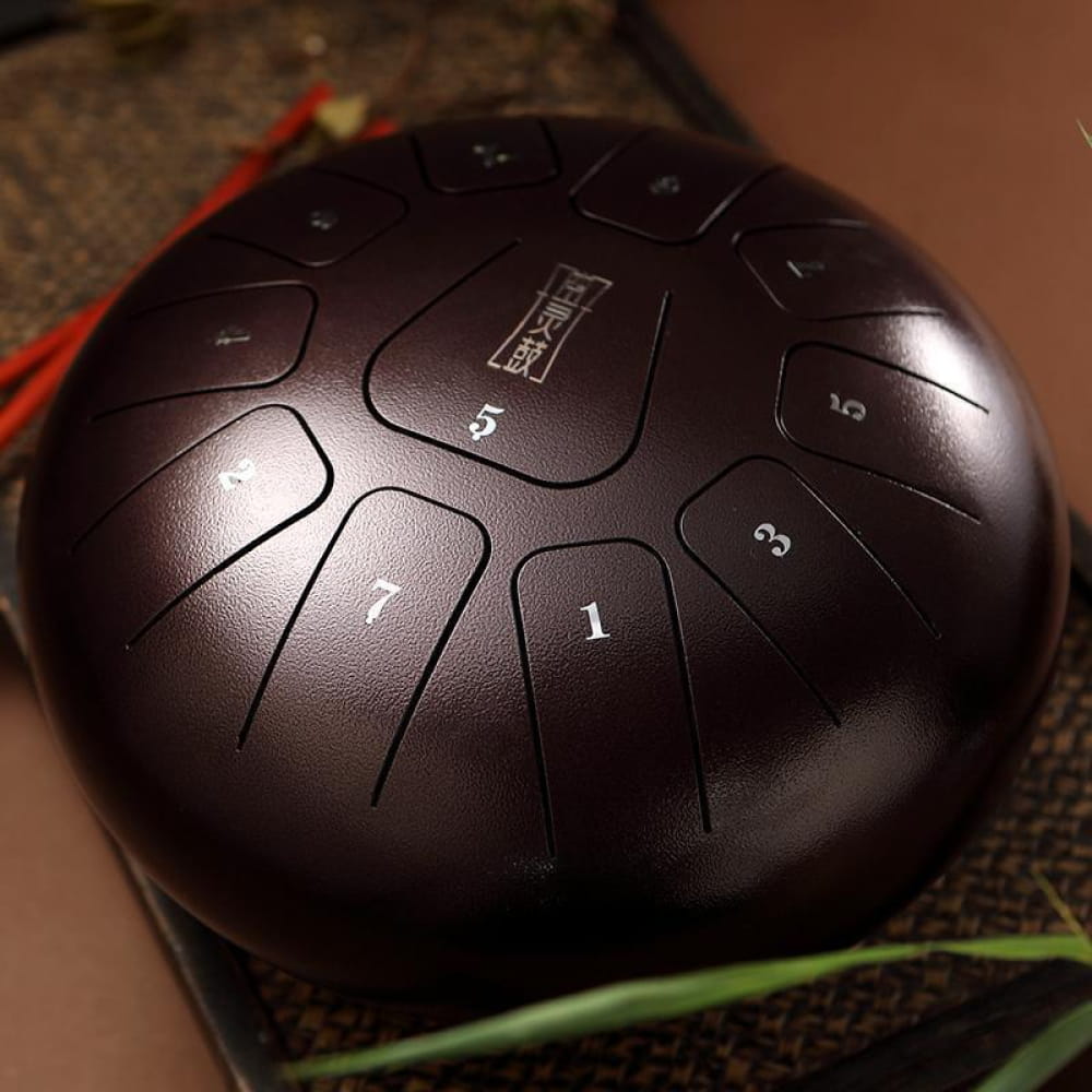Dark metallic 12-Inch Carbon Steel Tongue Drum with numbered sections in C Key