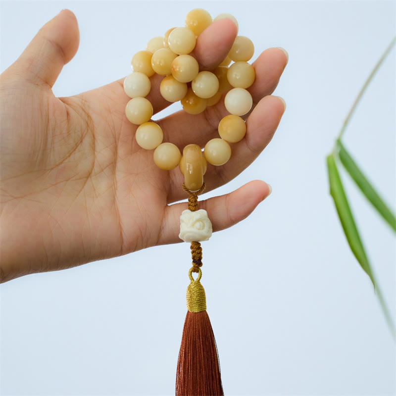 Mala de poignet en graines de Bodhi de 12 mm avec breloque lion dansant pour l'harmonie