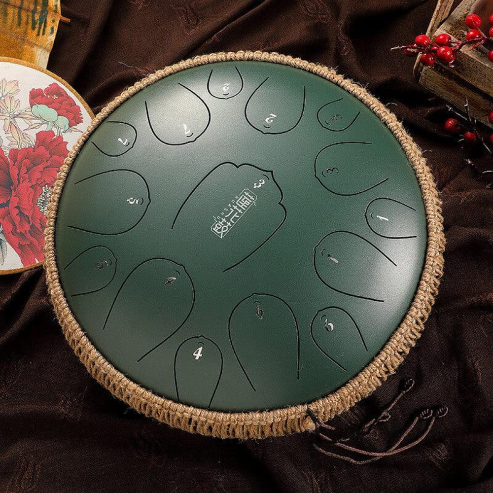 Dark green carbon steel tongue drum with 15 notes in D key and circular tone fields
