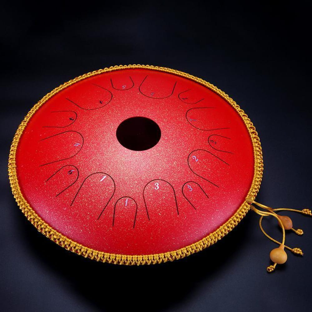 Red circular drum with gold trim and tassels, featured in 14 Inch C Key Steel Tongue Drum