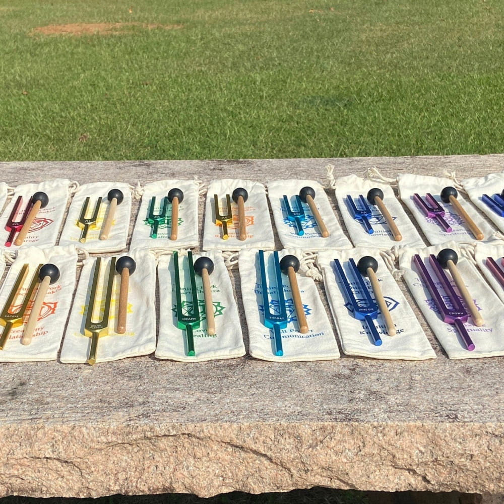 Colorful fountain pens arranged in rows for the Solfeggio Chakra Tuning Fork Set