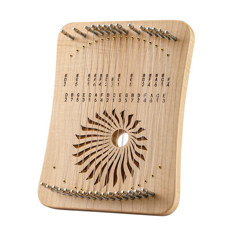 Wooden kalimba thumb piano with decorative sound hole pattern by Hluru