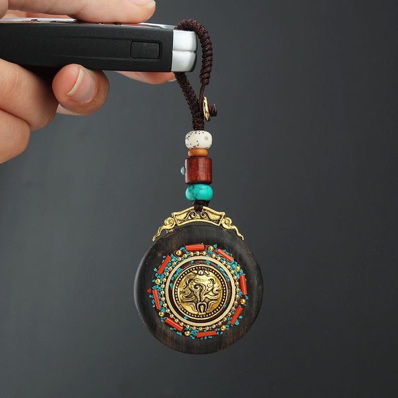 Porte-clés tibétain en bois d'ébène avec symbole de la paix Om Mani Padme Hum