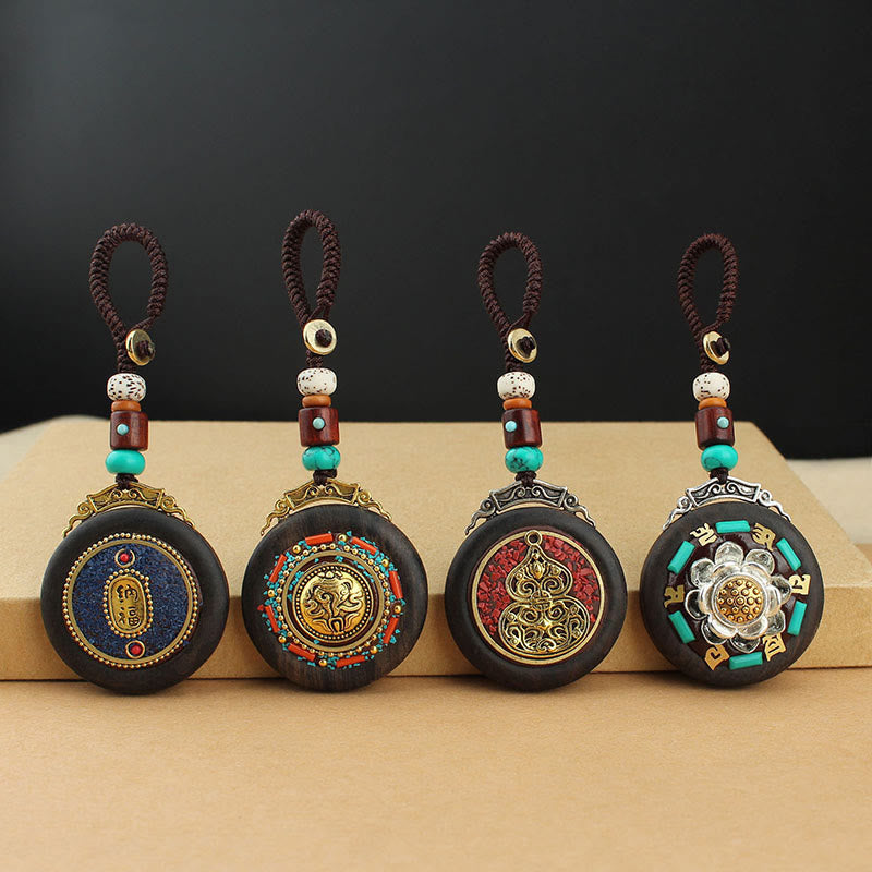 Porte-clés tibétain en bois d'ébène avec symbole de la paix Om Mani Padme Hum
