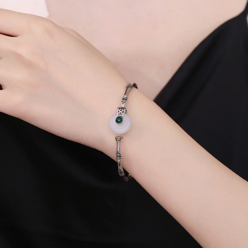 Bracelet manchette en cuivre et jade blanc avec boucle de paix et motif bambou