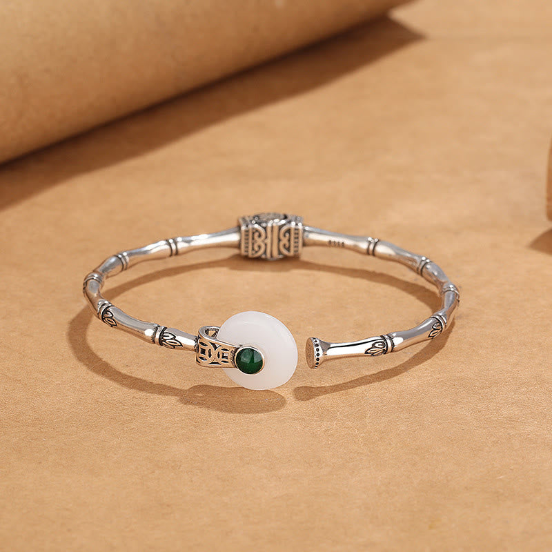 Bracelet manchette en cuivre et jade blanc avec boucle de paix et motif bambou