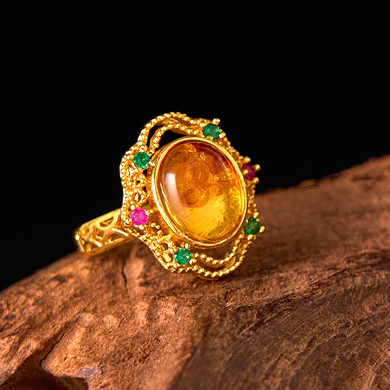 Bague ajustable en ambre fleurie pour la confiance et la force intérieure