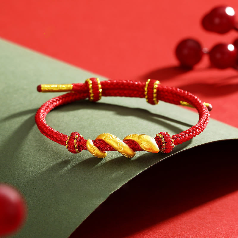 Bracelet de protection serpent en or 999 et fil rouge