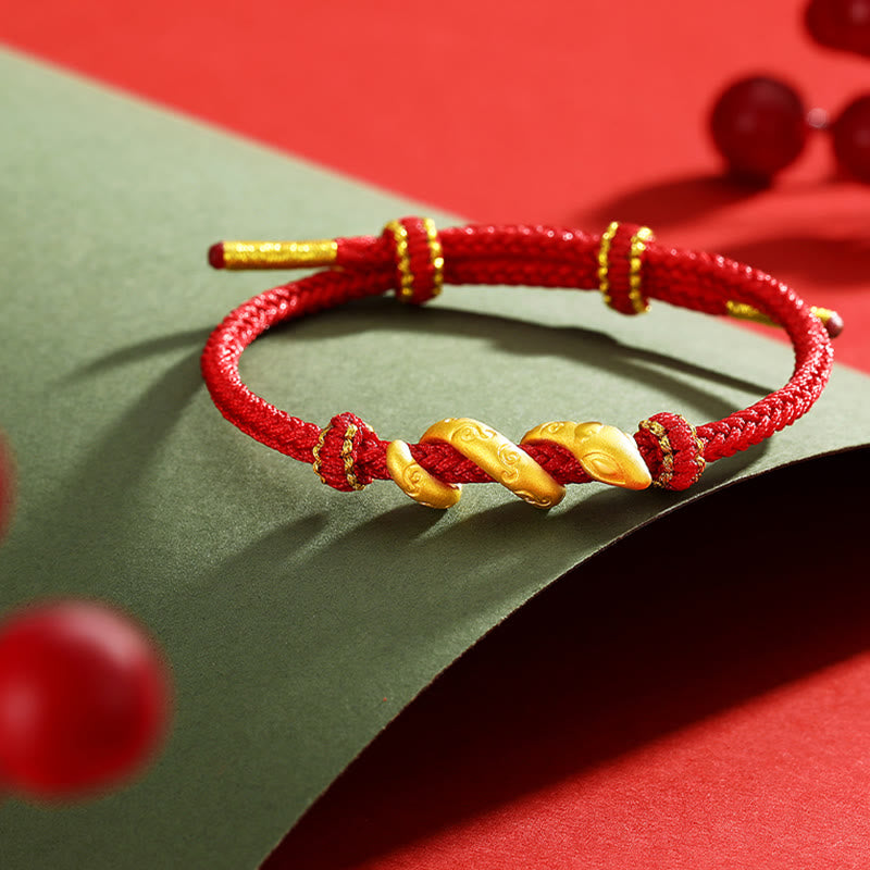Bracelet de protection serpent en or 999 et fil rouge