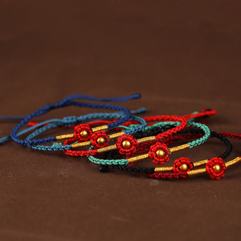 Bracelet de protection en fil rouge avec fleur dorée