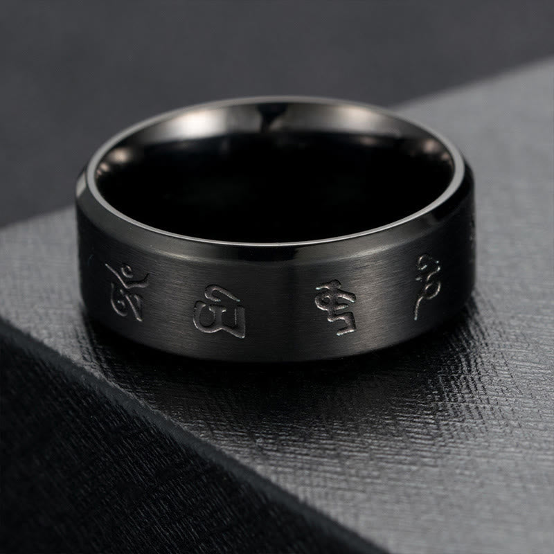 Bague en acier titane avec mantra Jambhala noir
