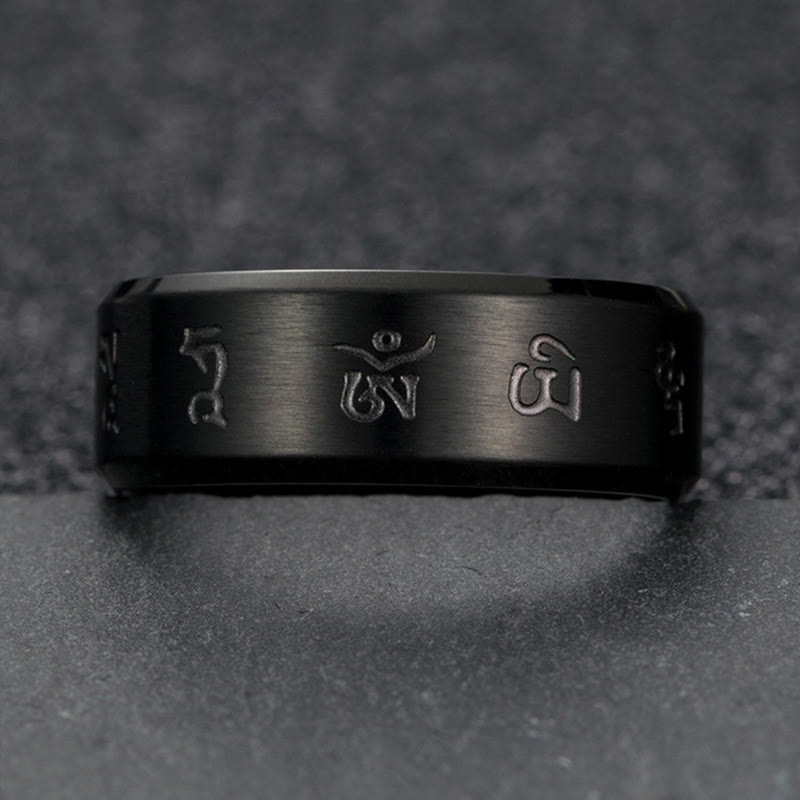 Bague en acier titane avec mantra Jambhala noir