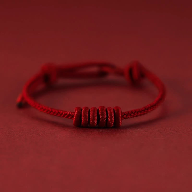 Bracelet de force à huit brins en corde rouge