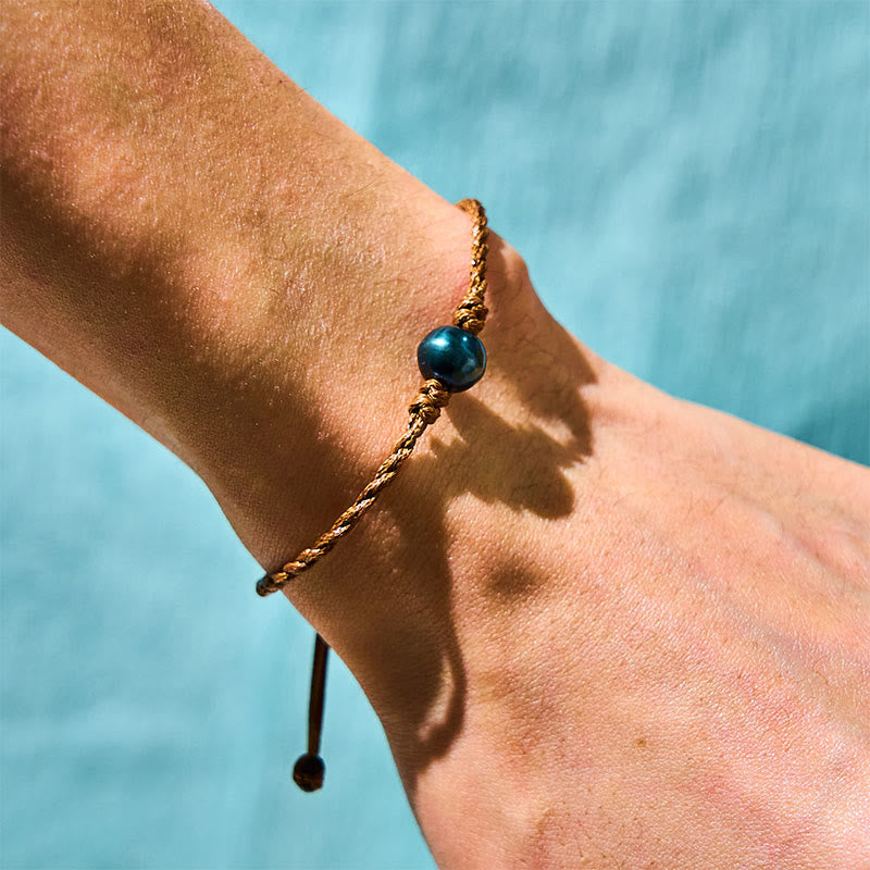 Bracelet Sagesse en perles noires de Tahiti sur corde cirée, 14-19 cm