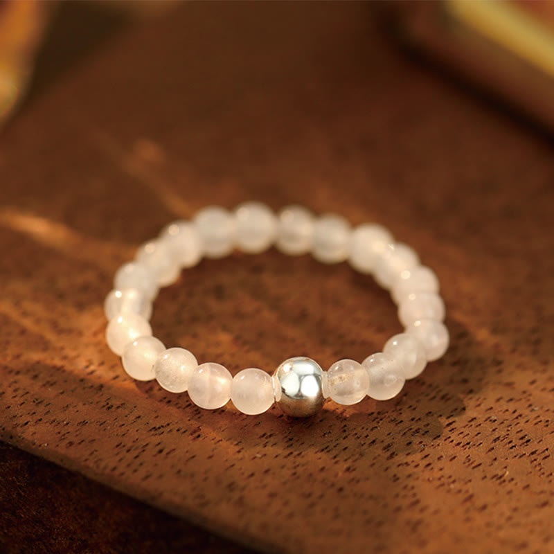 Bague élastique en perles de cristal d'onyx noir et jade blanc