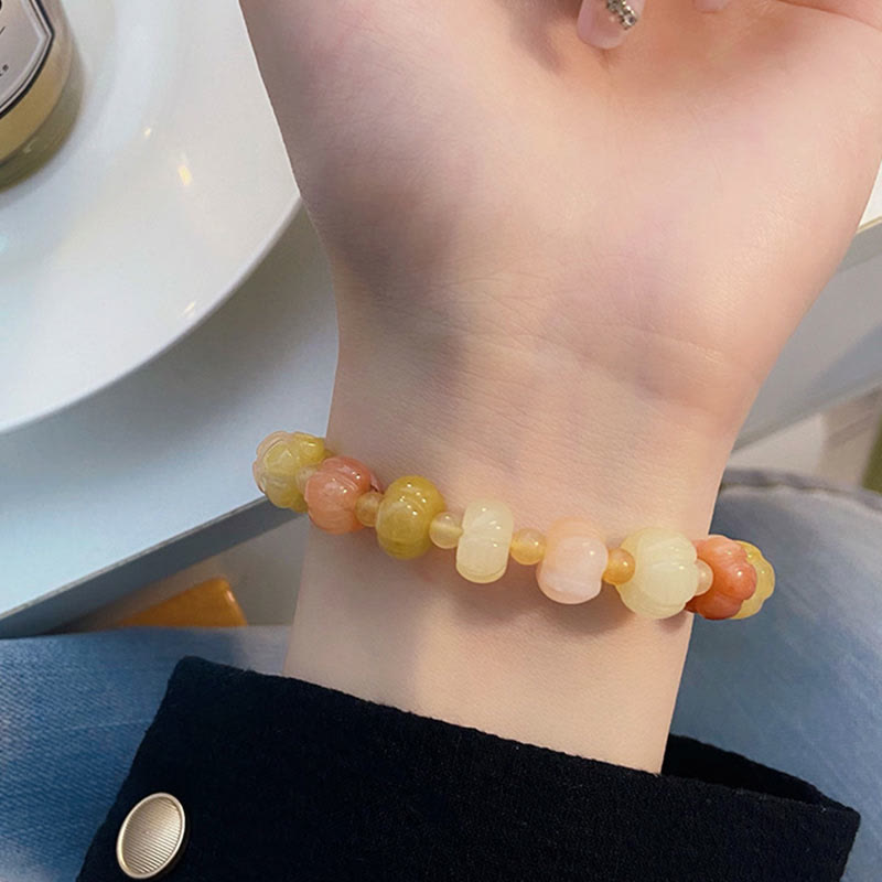 Bracelet en jade doré et soie 6x8 mm pour la richesse et la chance