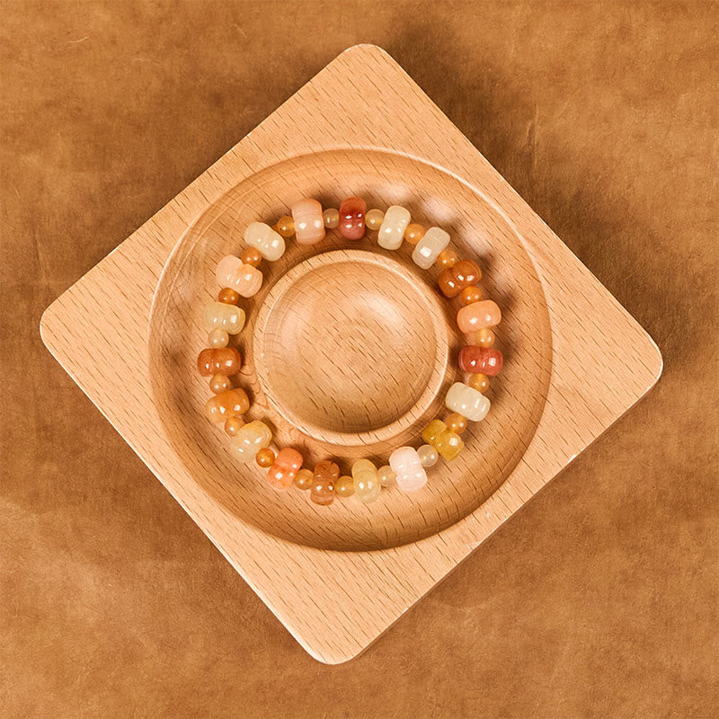 Bracelet en jade doré et soie 6x8 mm pour la richesse et la chance