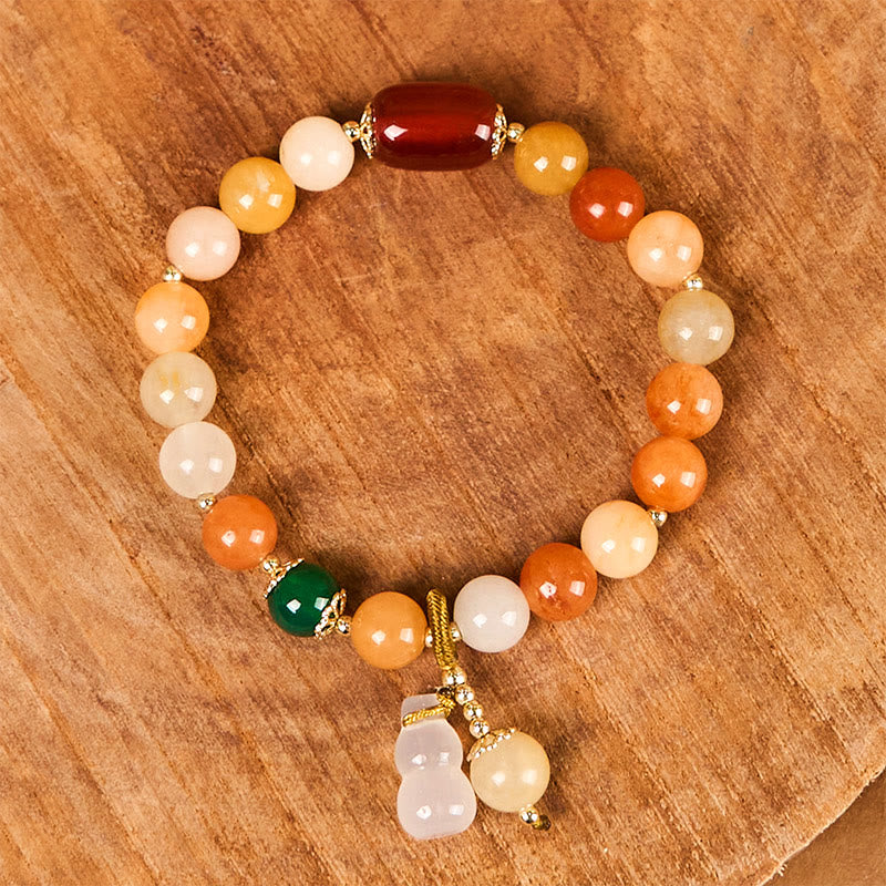 Bracelet en jade de soie dorée de 8 mm pour la richesse et la chance