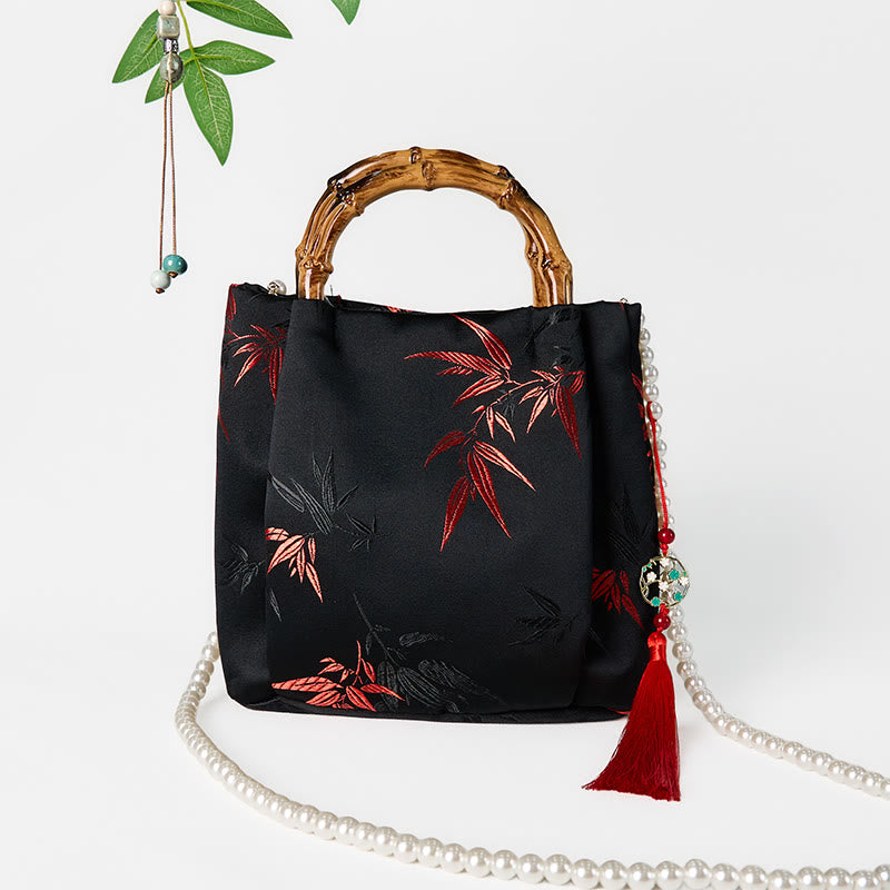 Sac en polyester et coton noir brodé de feuilles avec poignée en bambou