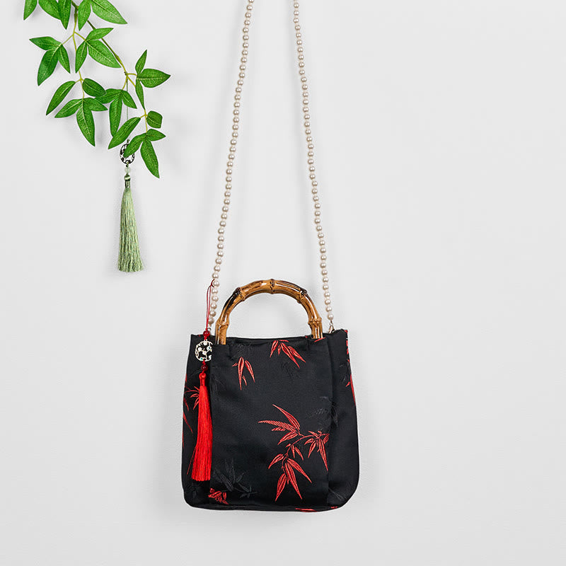 Sac en polyester et coton noir brodé de feuilles avec poignée en bambou