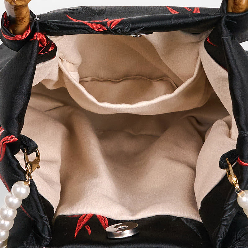 Sac en polyester et coton noir brodé de feuilles avec poignée en bambou