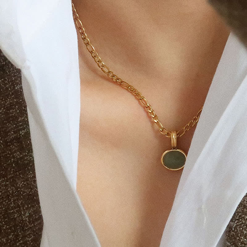 Collier pendentif ovale turquoise en acier titane