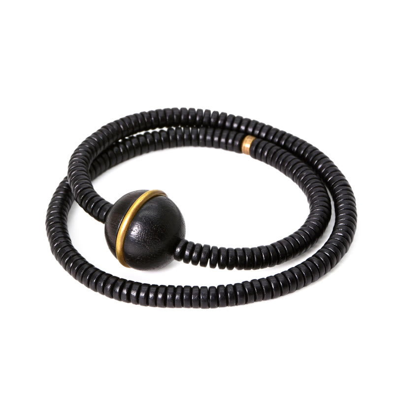 Bracelet boule en laiton et bois d'ébène de 18 mm pour l'équilibre et le calme
