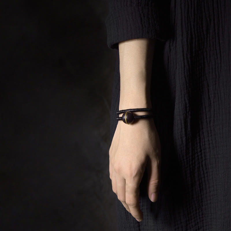 Bracelet boule en laiton et bois d'ébène de 18 mm pour l'équilibre et le calme
