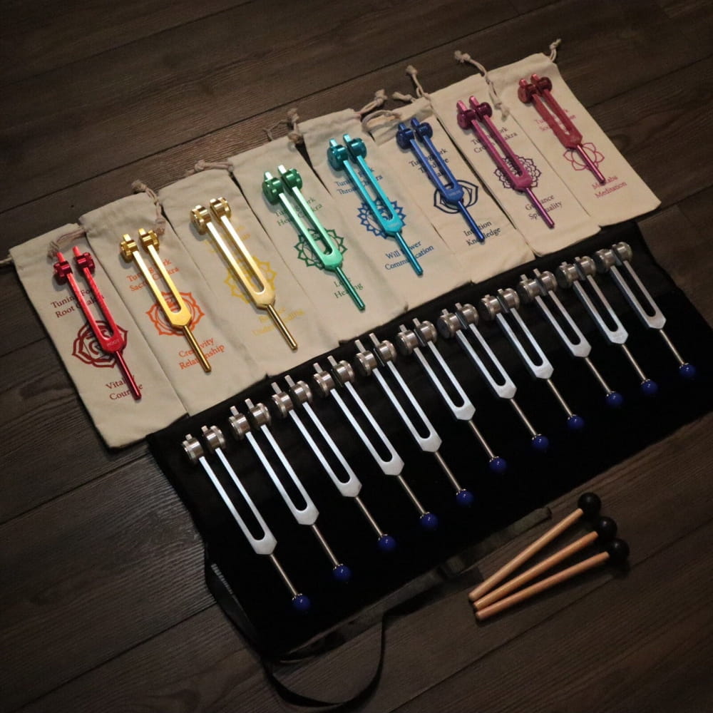 Colorful tuning forks on fabric, part of 19pc Chakra and Planetary Tuning Fork Set