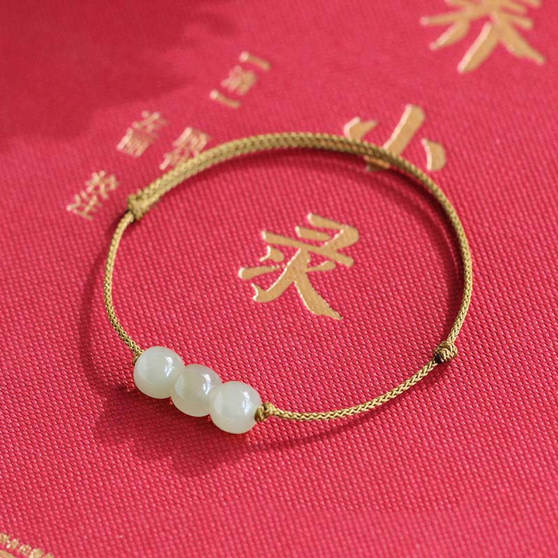 Bracelet porte-bonheur en jade à trois perles tissées