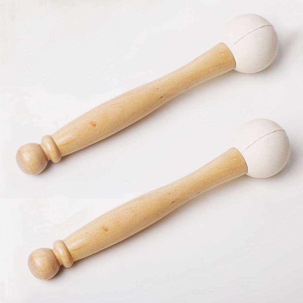Two wooden massage tools with white ball tips for Crystal Singing Bowl use