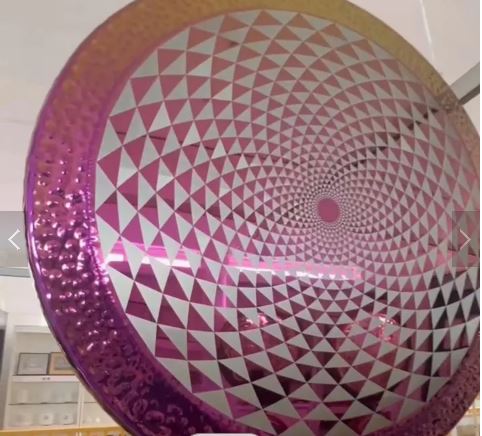 Pink and silver metallic balloon with geometric spiral pattern for sound healing