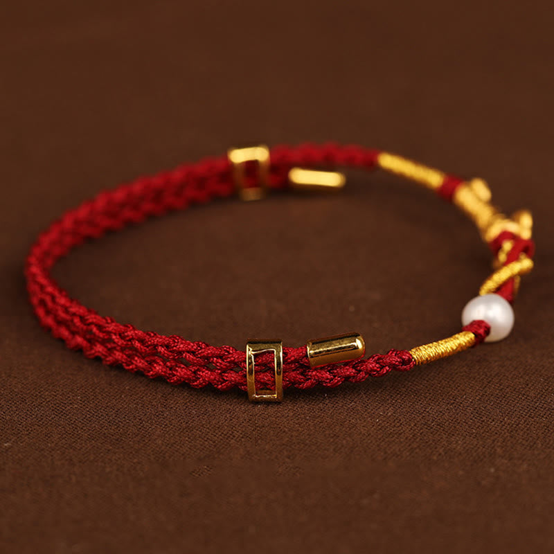 Bracelet porte-bonheur en or 24 carats avec fil rouge