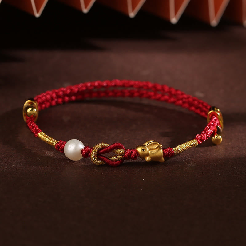 Bracelet porte-bonheur en or 24 carats avec fil rouge