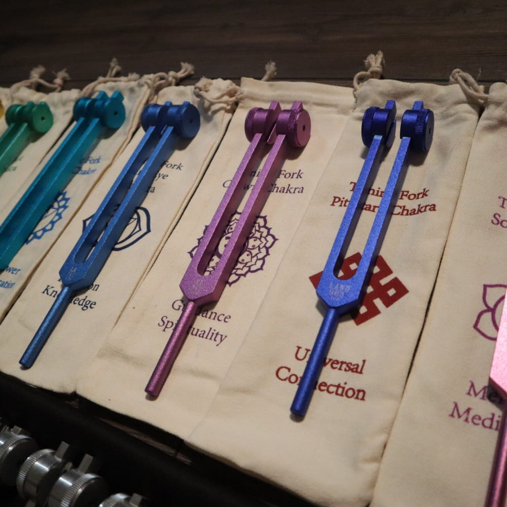 Colorful tuning forks on fabric pouches from 28pc Solfeggio & Planetary Tuning Fork Set