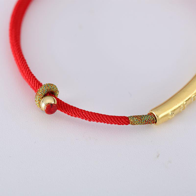 Bracelet porte-bonheur en argent et fil rouge Om Mani Padme Hum